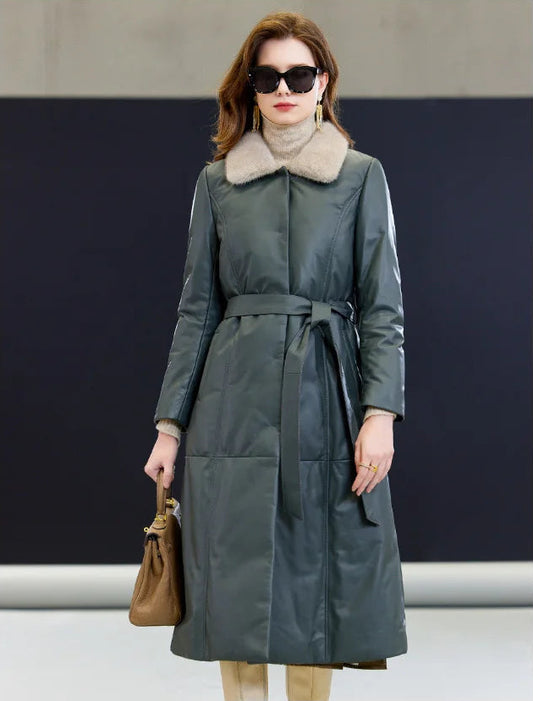 Model wearing the Signature minimalist sheepskin coat, holding a brown structured bag — From Borcelleclothes.