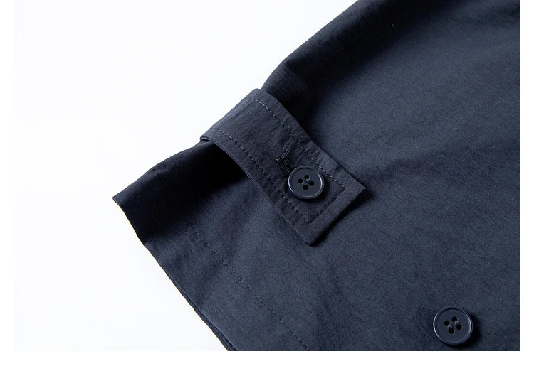 Close-up of side adjustable tabs with buttons — functional detail that ensures fit without compromising form. From Borcelleclothes.