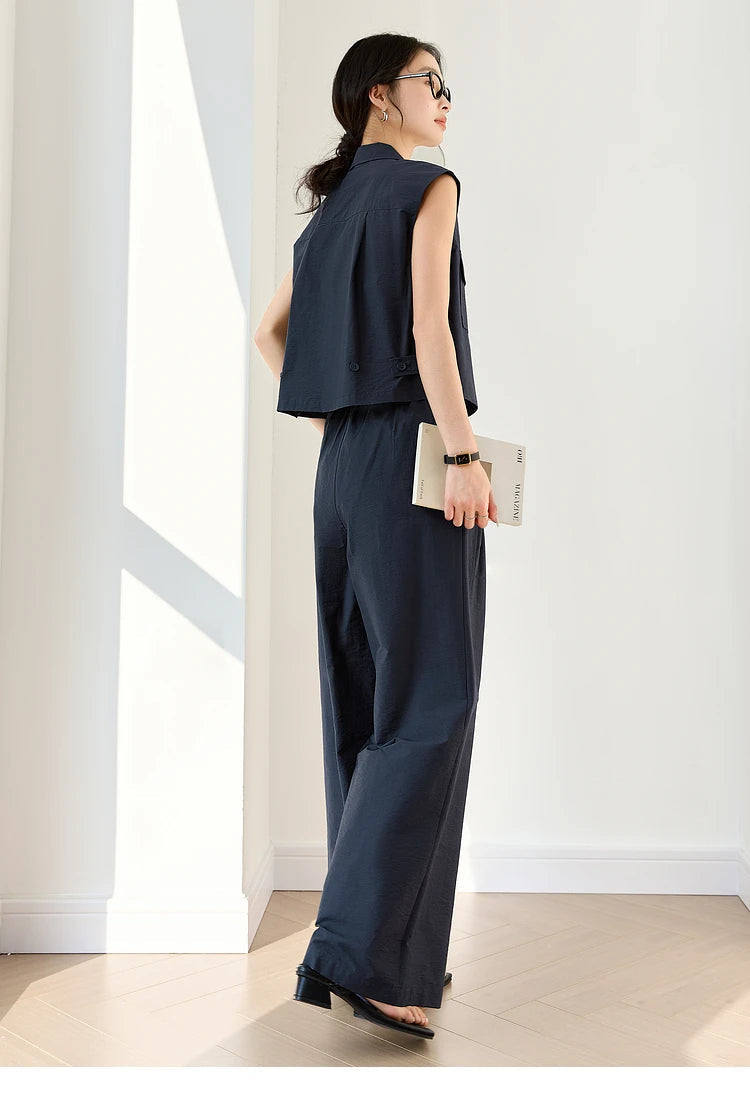 Back view of Mirage set showing pleated yoke on vest and the drape of straight-leg trousers. From Borcelleclothes.
