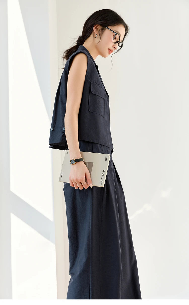 Profile view of the Mirage two-piece set — clean lines and architectural silhouette from shoulder to hem. From Borcelleclothes.