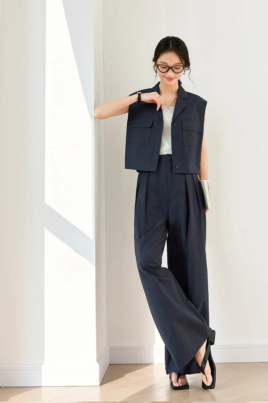 Women’s two-piece set in Mirage color featuring a structured sleeveless vest and straight-leg trousers — a refined, urban silhouette with minimalist strength. From Borcelleclothes.