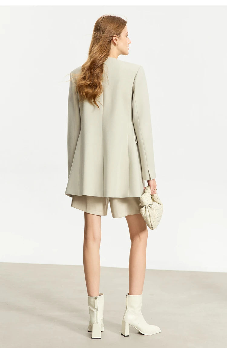 Model wearing a Women’s Moon Mist wrap blazer, back view – From Borcelleclothes.