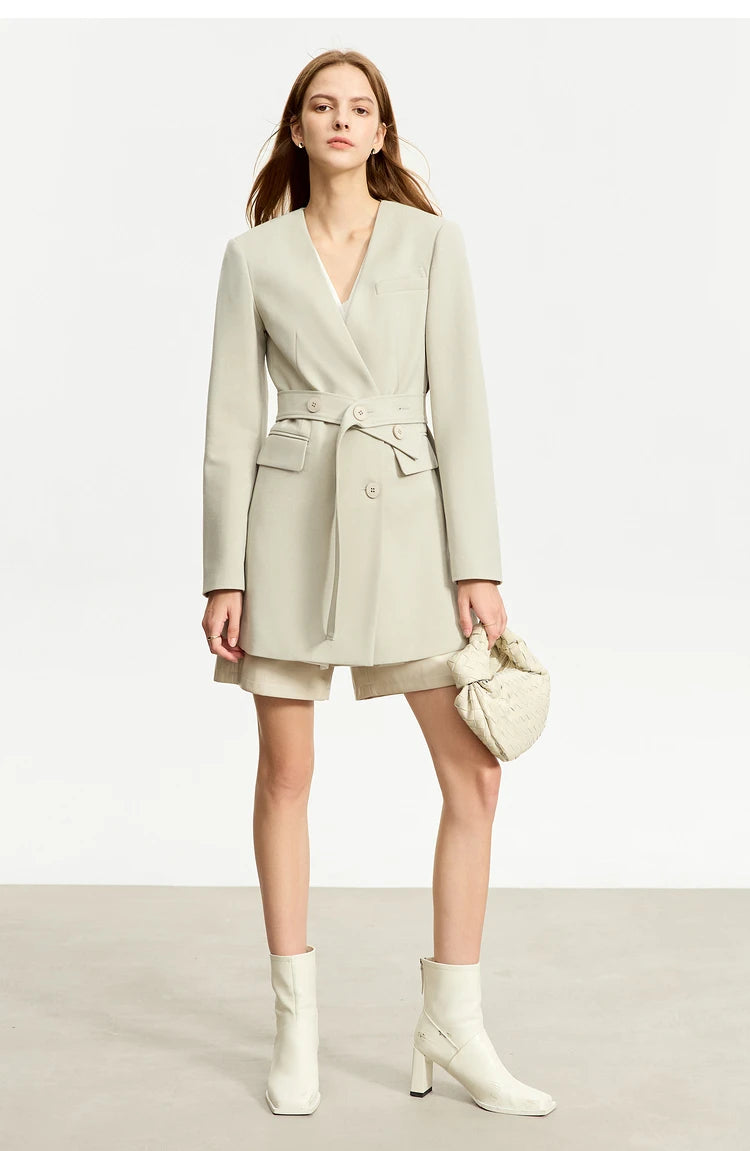 Women’s Moon Mist wrap blazer, model with bent leg – From Borcelleclothes.