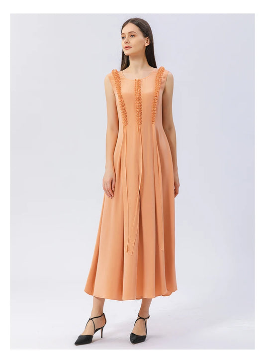 Model with foot in motion, wearing the flowing silk dress in Folklore Rose. From Borcelleclothes.