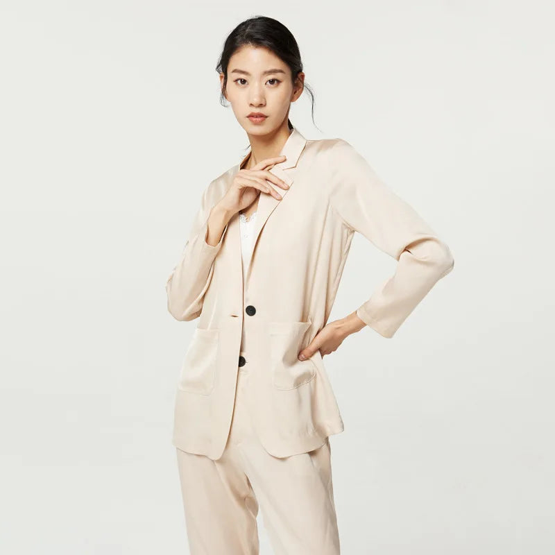 Women’s Mulberry silk satin blazer in Pearl Bush — single-breasted with notch lapels and rounded patch pockets, cut to offer breathability, softness, and ease for warm days. From Borcelleclothes.