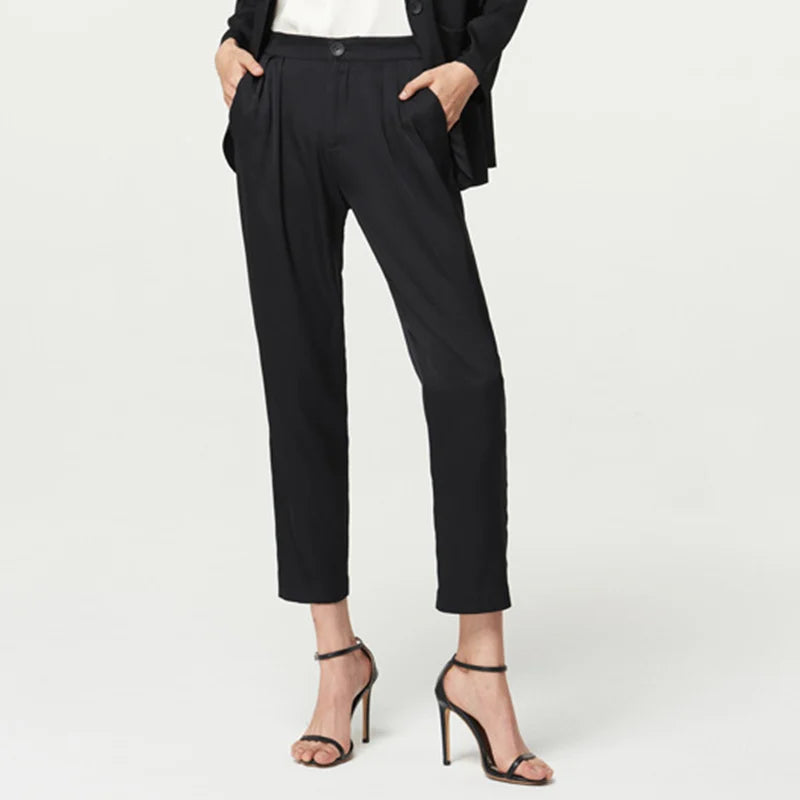 Women’s Mulberry silk satin pants in Onyx — slim-cut, ankle-length trousers with front pleats and a soft waistband, designed for movement without demand. From Borcelleclothes.