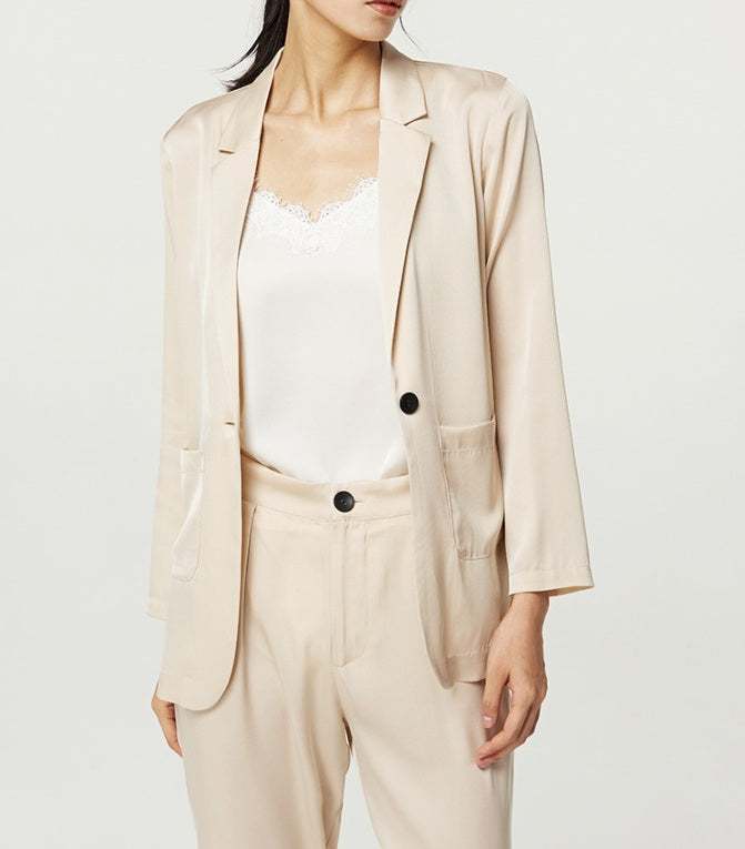 Model in Pearl Bush silk satin set, blazer unbuttoned — a relaxed, airy silhouette made for movement and comfort. From Borcelleclothes.