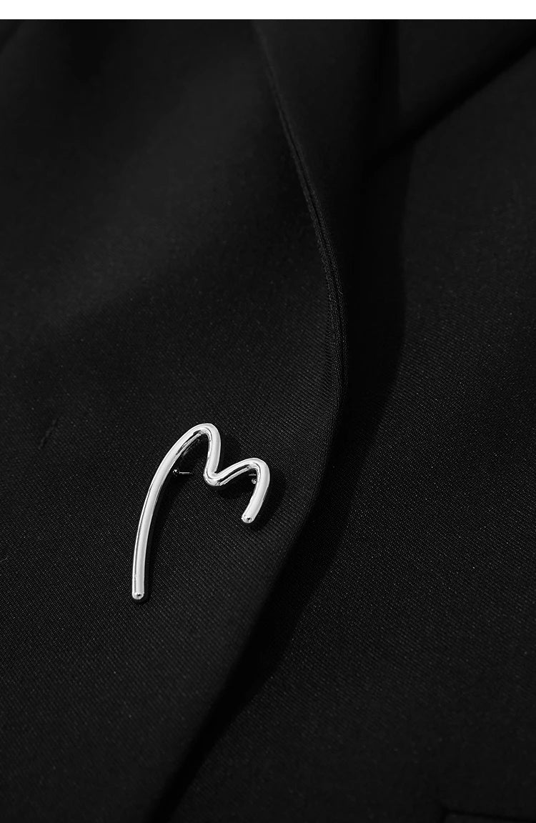 Onyx minimal blazer detail of metal unfinished heart decoration at the waist – From Borcelleclothes.