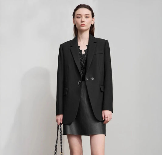 Women's Onyx minimal blazer with thigh-length silhouette, clean lines, no buttons, and a single unfinished heart metal accent at the waist – From Borcelleclothes.