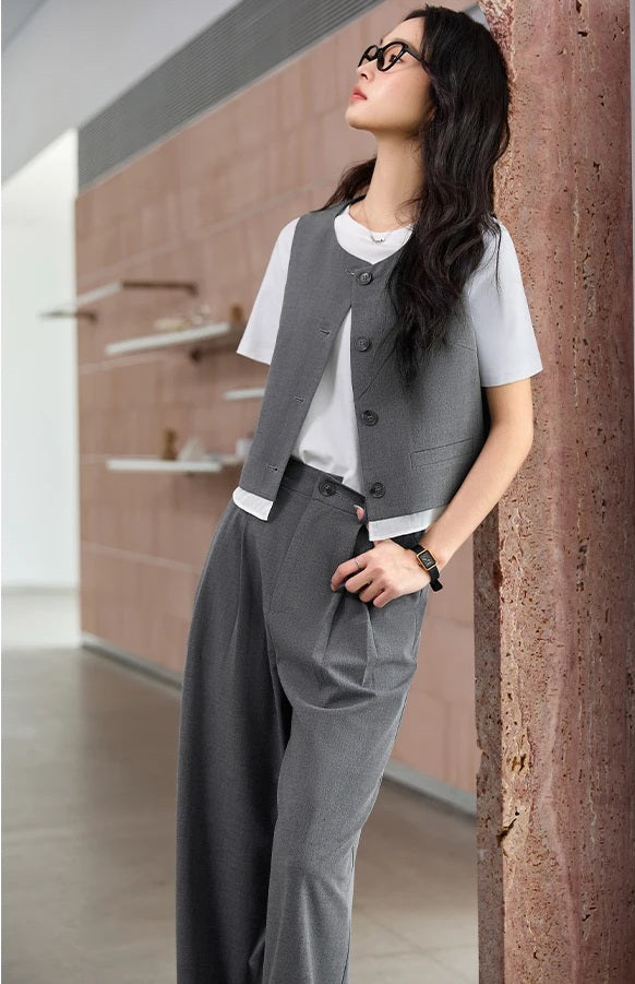 Model leaning against an interior wall while wearing the Payne’s Grey two-piece set, echoing the calm of the setting. From Borcelleclothes.
