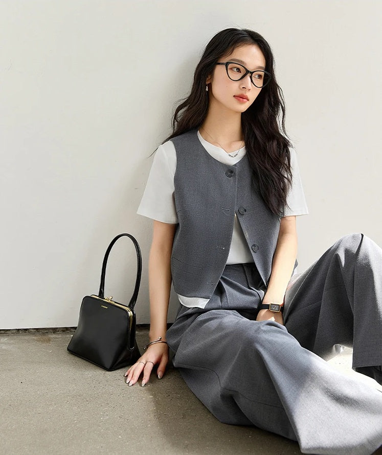 Model sitting on the floor in the Payne’s Grey two-piece set, highlighting the relaxed silhouette and subdued tone. From Borcelleclothes.