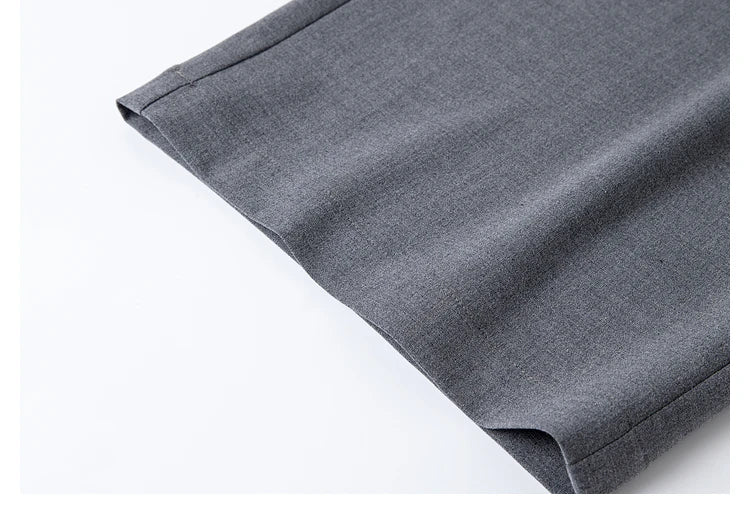Bottom hem of the trousers from the Payne’s Grey two-piece set, finished with quiet precision. From Borcelleclothes.