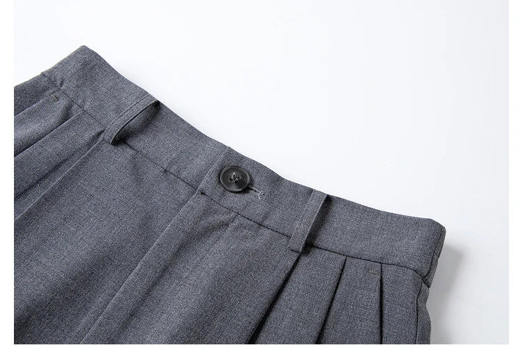 Detail of the waistband on the trousers from the Payne’s Grey two-piece set, showing belt loops and elastic back. From Borcelleclothes.