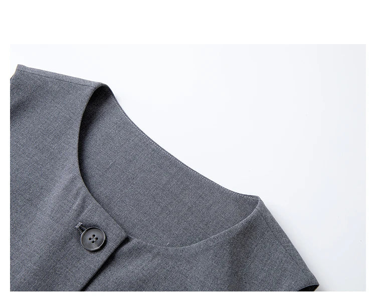 Detail of the round neckline on the vest from the Payne’s Grey two-piece set. From Borcelleclothes.