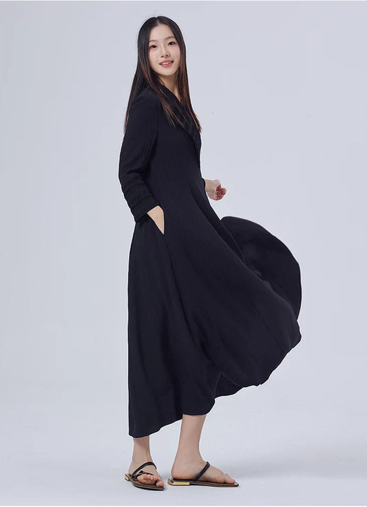 Side view of the dress, showing the defined silhouette and balance between structure and fluidity. From Borcelleclothes.
