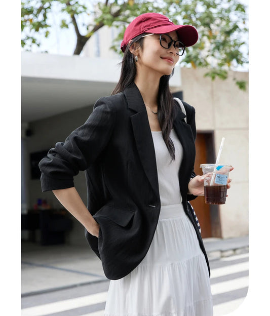 Women’s Platinum & Onyx Urban Blazer in Onyx, with thigh-length cut, notch lapels, and single button design, crafted for composed and unhurried elegance. From Borcelleclothes.