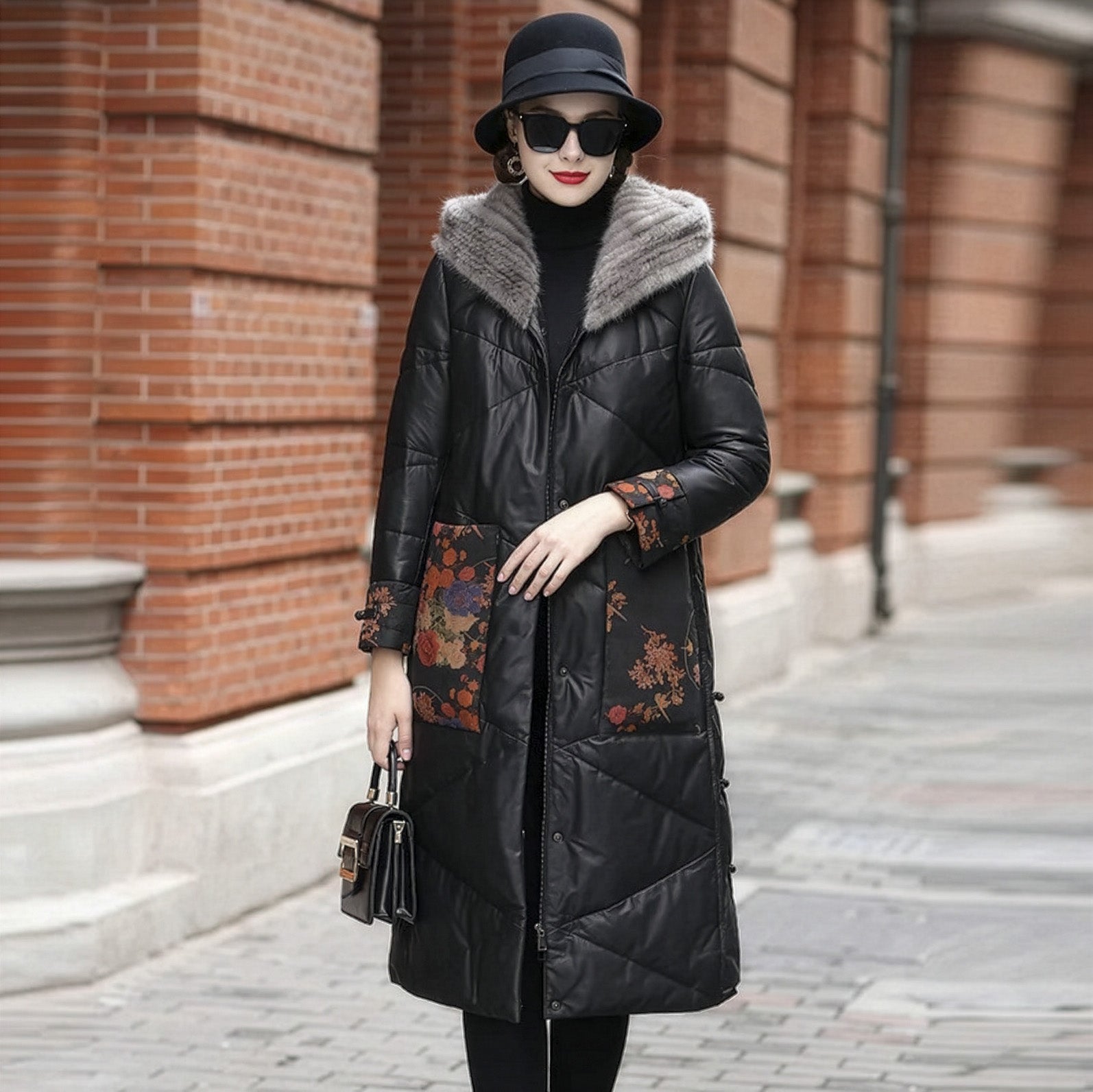Model with bent arm in Onyx sheepskin coat featuring floral leather accents, artisanal knots, and a sculptural A-line silhouette — From Borcelleclothes.