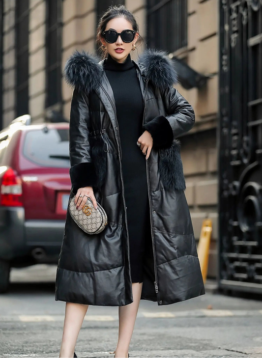 Women's sheepskin coat with tonal fur variations and a hood, highlighting the layered textures and softly structured silhouette — From Borcelleclothes.