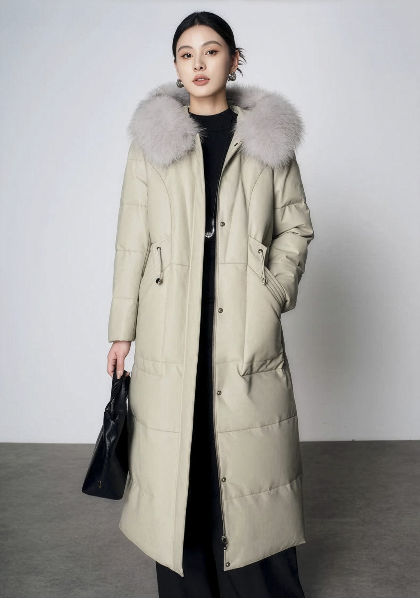 Women's Sheepskin Coat with Hidden Casing in Moon Mist — model holding black bag. From Borcelleclothes.