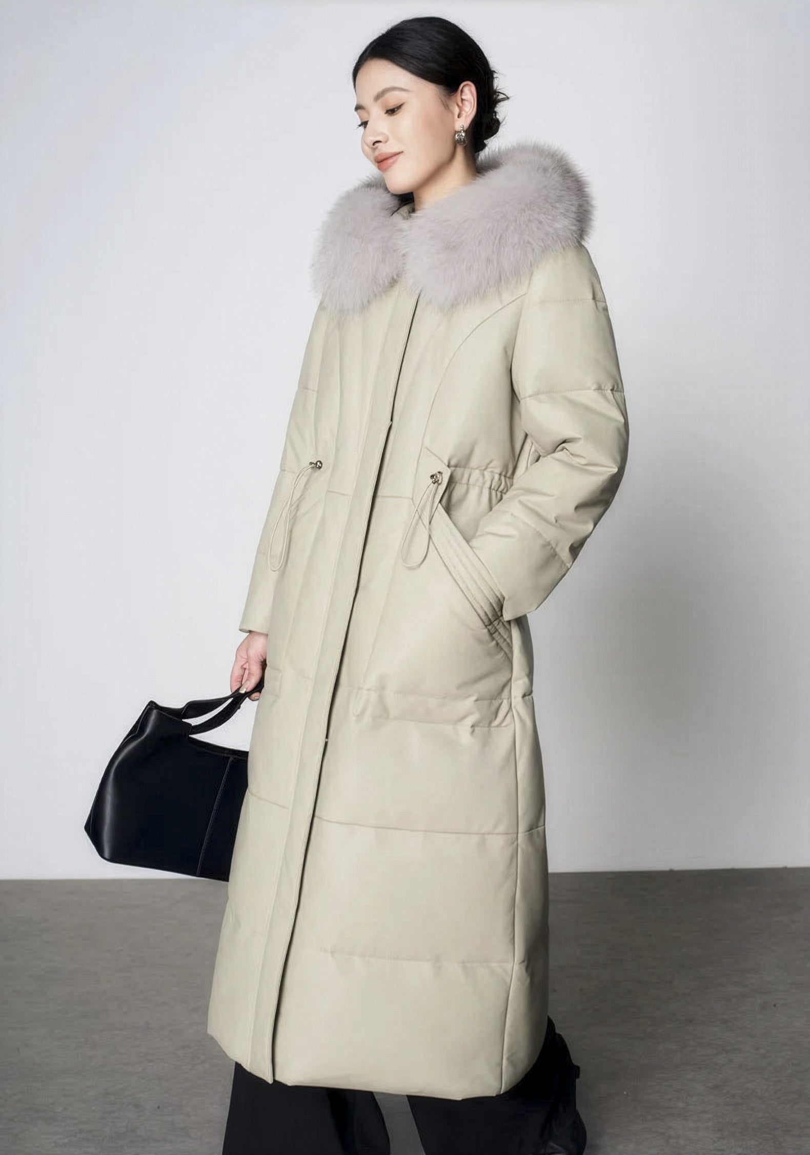 Women's Sheepskin Coat with Hidden Casing in Moon Mist — model walking, side view. From Borcelleclothes.