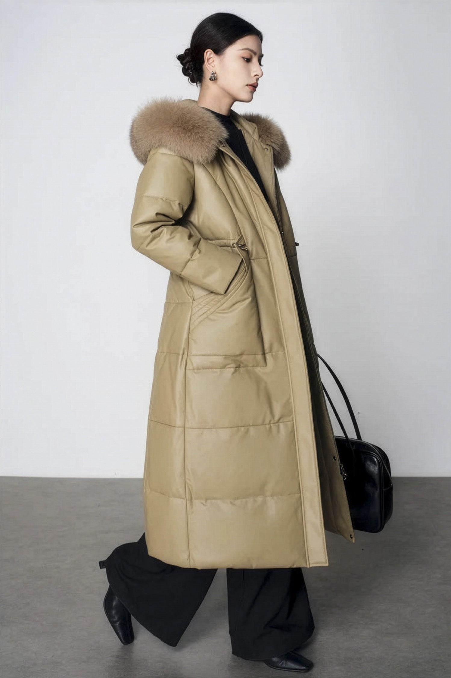Women's Sheepskin Coat with Hidden Casing in Sweet Angelica — model walking, side view. From Borcelleclothes.