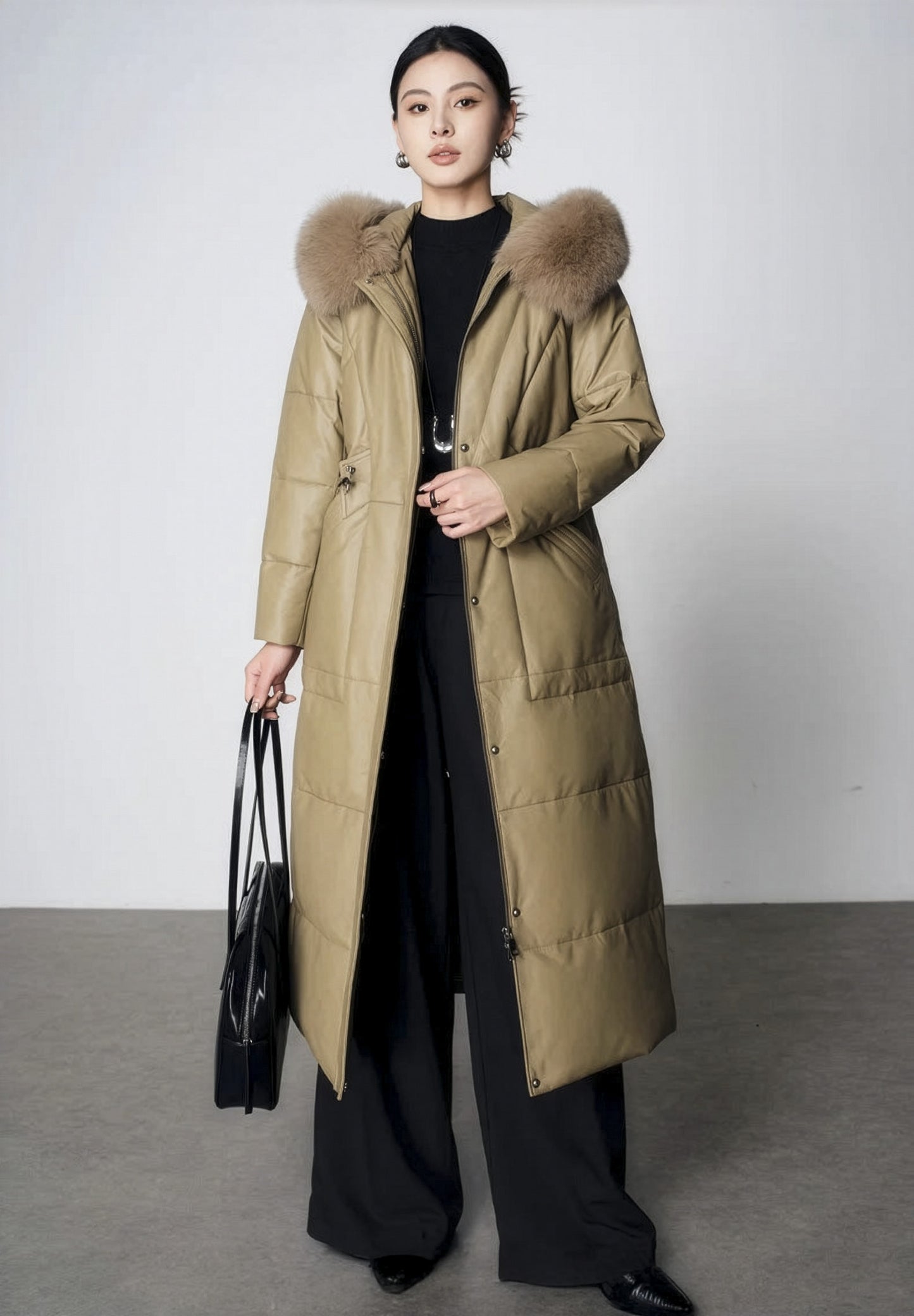 Women's Sheepskin Coat with Hidden Casing in Sweet Angelica — unfastened, model holding front edge. From Borcelleclothes.