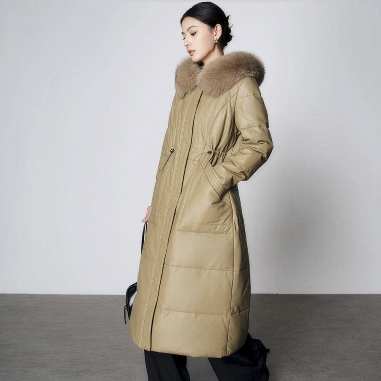Women's Sheepskin Coat with Hidden Casing in Sweet Angelica. Fox-trimmed hood, hidden drawstring waist, goose down fill, mid-calf length. Borcelleclothes.