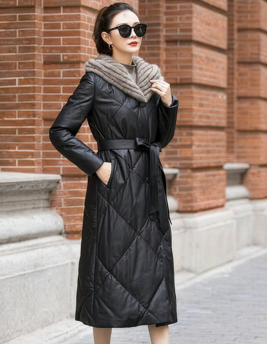 Model wearing Onyx sheepskin coat with mink-lined hood, gently touching the hood. — From Borcelleclothes.