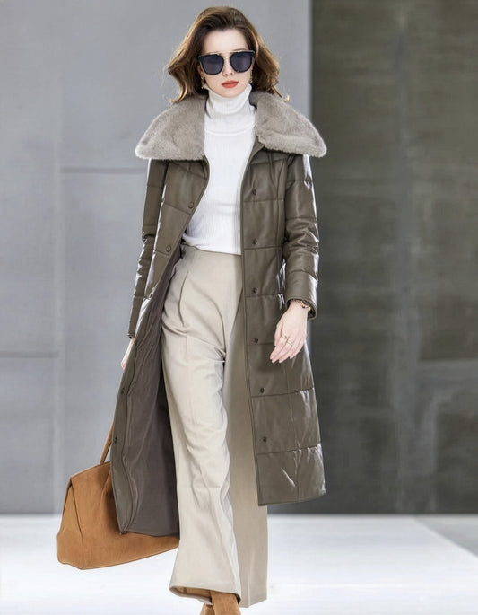 Woman walking in Almond Frost sheepskin coat with wide mink collar and tonal belt — From Borcelleclothes.