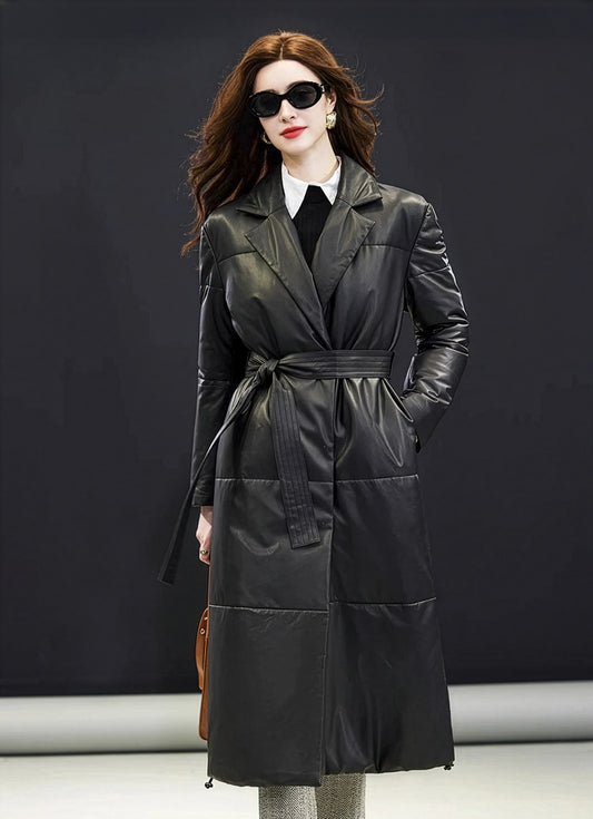 Model places her hand in the side pocket of the Onyx sheepskin coat, revealing the wrap silhouette and soft sheen — From Borcelleclothes.