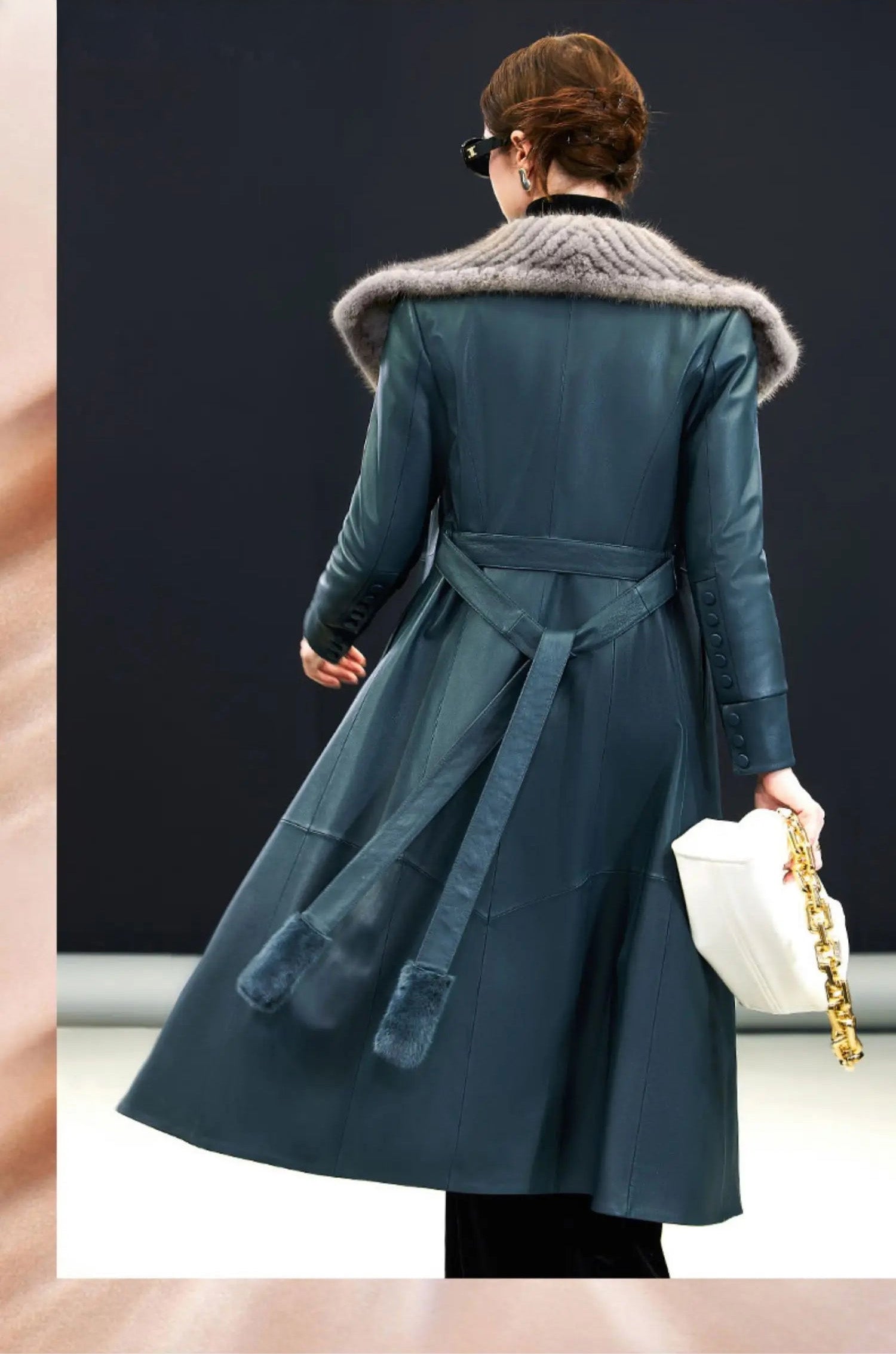 Back view of the Independence sheepskin coat, with flared shape and centered seam — From Borcelleclothes.