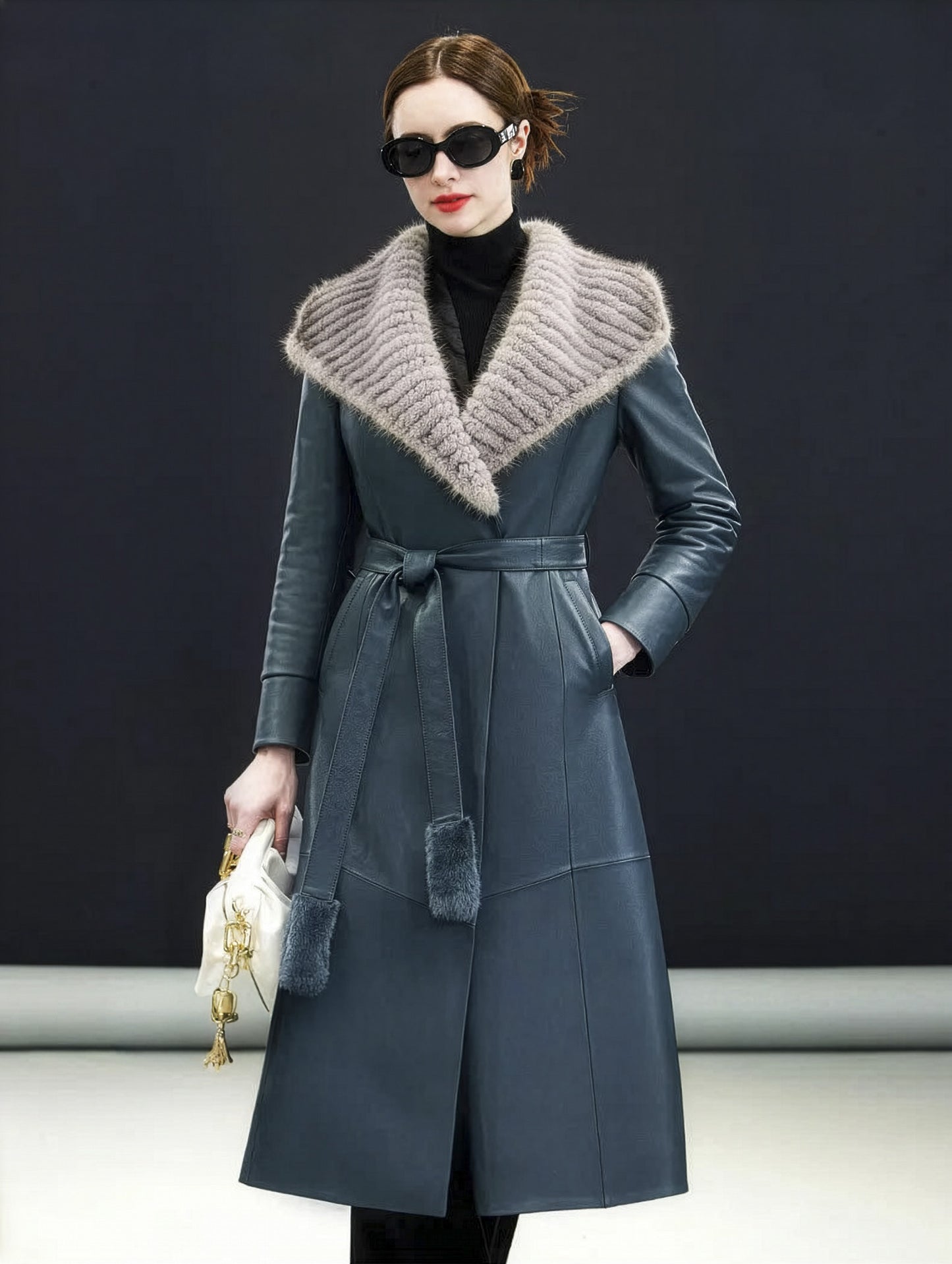 Model in Independence coat resting hand in diagonal welt pocket, waist cinched — From Borcelleclothes.