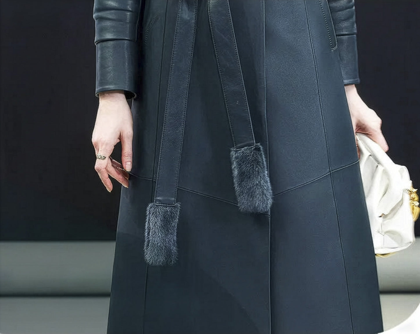 Close-up of tonal mink tassels at the ends of the belt on Independence coat — From Borcelleclothes.