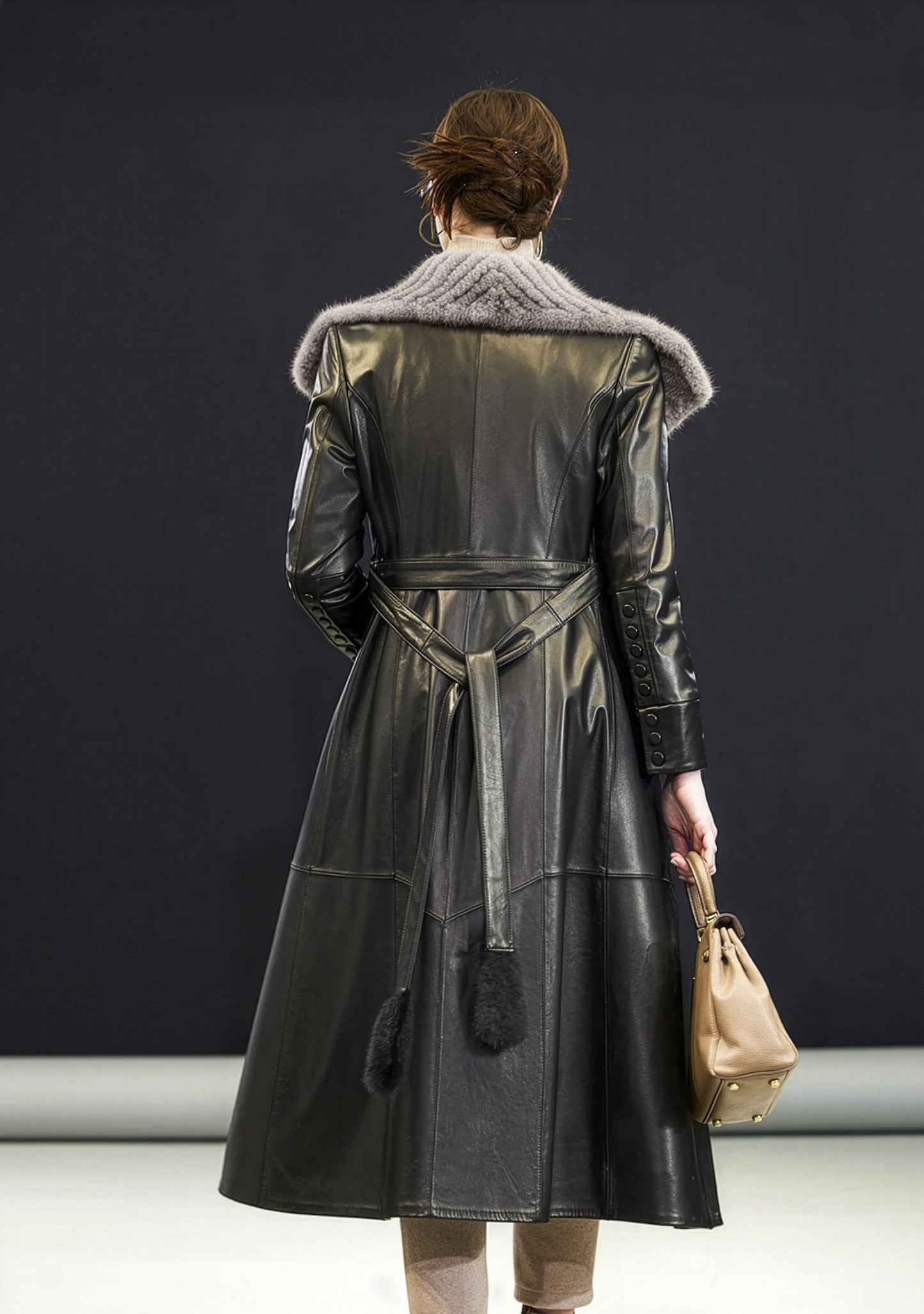 Back view of Onyx sheepskin coat showing princess seams and flared A-line hem — From Borcelleclothes.