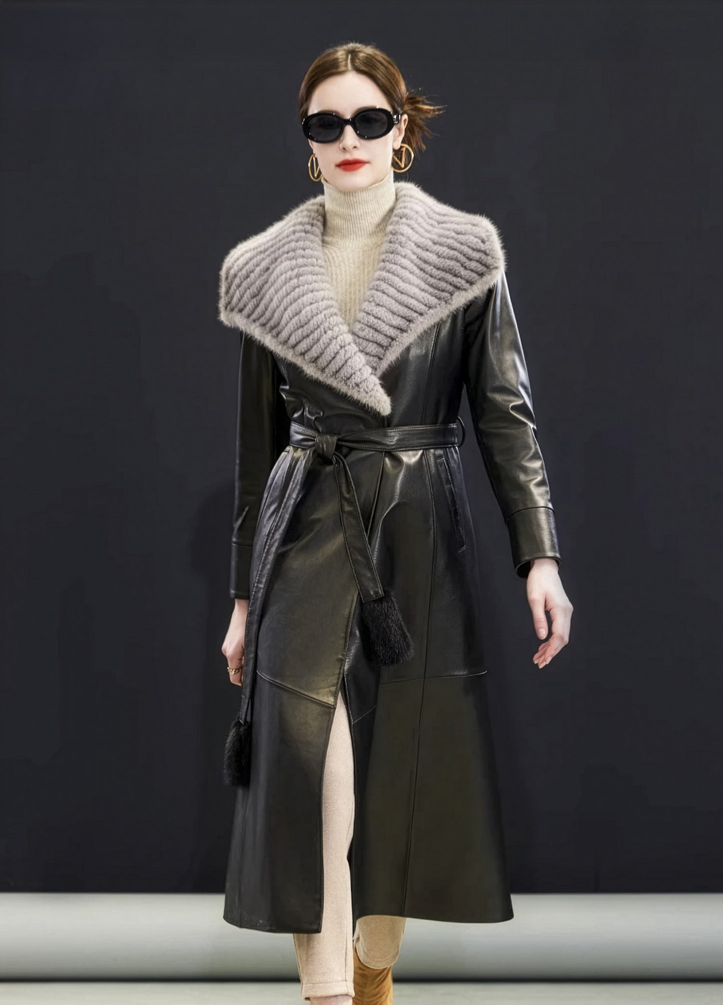 Model in Onyx sheepskin coat walking, striped mink collar draped over shoulders, fur tassels swaying — From Borcelleclothes.