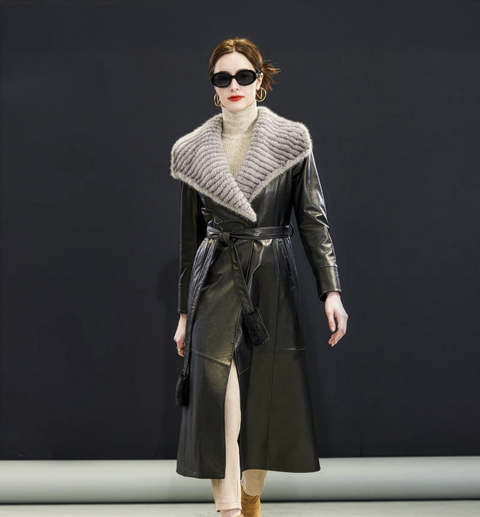 Women's Mid-calf sheepskin coat in Onyx color, with wide striped mink collar extending to the arms, leather snap cuffs, and fur-tipped belt — From Borcelleclothes.