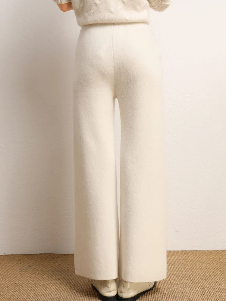 Back view of model wearing Almond straight-cut Alashan cashmere trousers — From Borcelleclothes.
