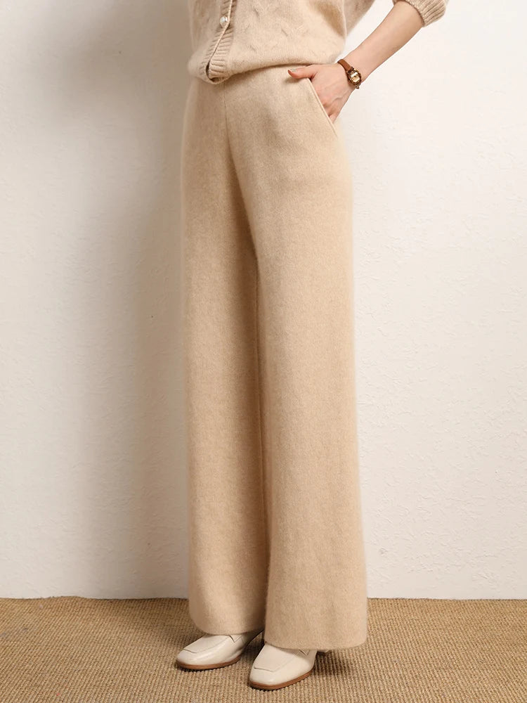 Model’s hand in front slash pocket of Desert Sand straight-cut cashmere trousers — From Borcelleclothes.