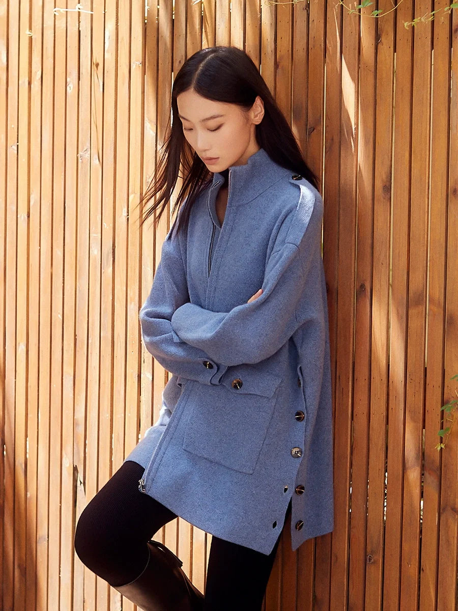 Model wearing Frosted Blueberry cashmere cardigan with arms crossed, highlighting front structure and sleeve volume — From Borcelleclothes.