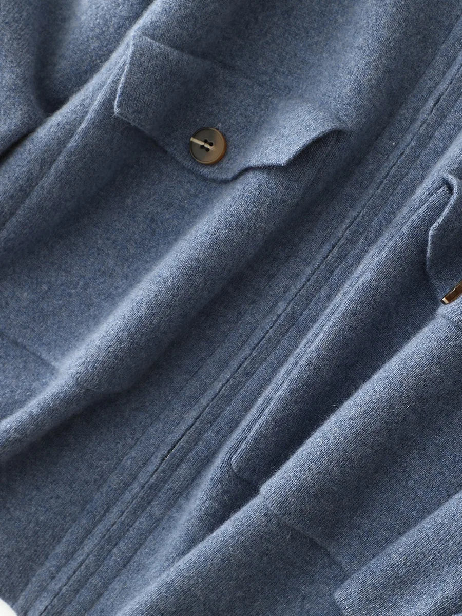 Detailed view of patch pockets with flaps on structured cashmere cardigan in Frosted Blueberry — From Borcelleclothes.