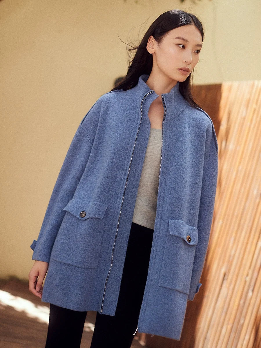 Women's structured cashmere cardigan in Frosted Blueberry with coat-inspired details, including patch pockets, shoulder tabs, and buttoned side vents — From Borcelleclothes.