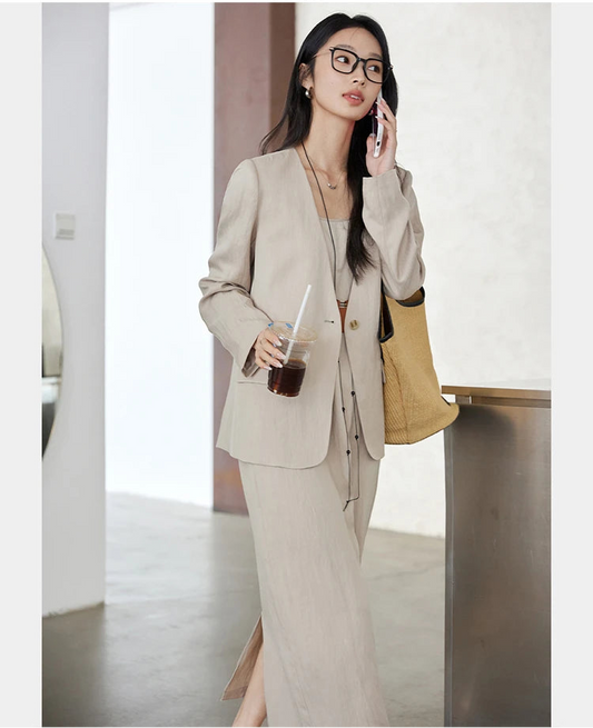 Women’s two-piece set in Swiss Coffee color featuring a single-breasted jacket with long sleeves and an A-line camisole dress with adjustable straps. From Borcelleclothes.