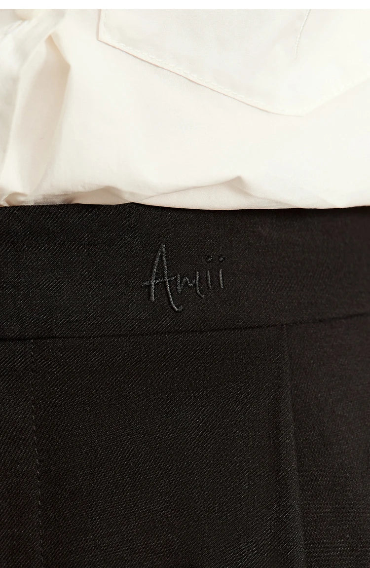 Subtle AMII embroidery detail on waistband of Onyx tailored cropped trousers, like a signature mark. From Borcelleclothes.