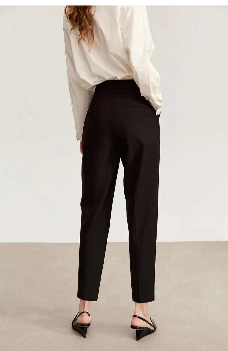 Back view of Onyx tailored cropped trousers, with emphasis on the clean lines and ankle-grazing cut. From Borcelleclothes.