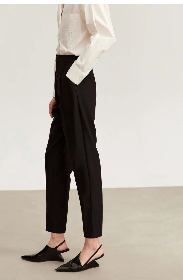 Left side view of Onyx cropped trousers, revealing the minimal tailoring and architectural balance. From Borcelleclothes.