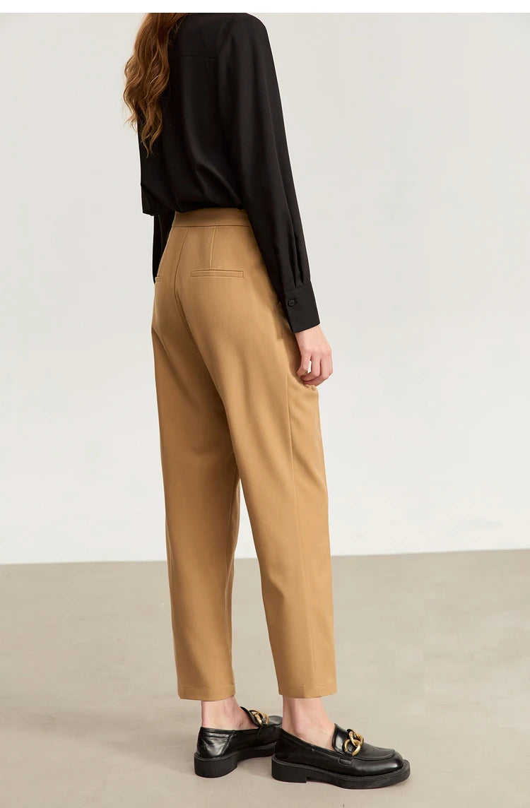 Back view of Sand Brown tailored cropped trousers, highlighting the minimalist waistband and soft drape. From Borcelleclothes.