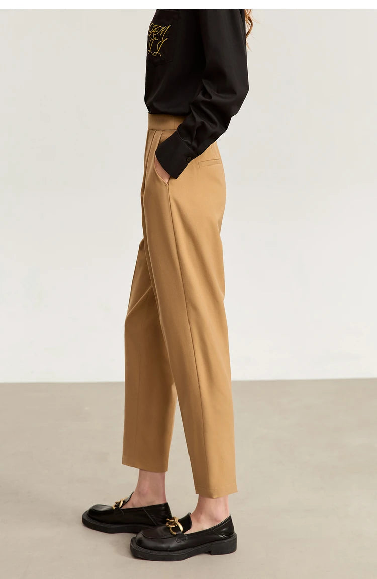 Left side view of Sand Brown tailored cropped trousers, highlighting their sculpted minimalist form. From Borcelleclothes.