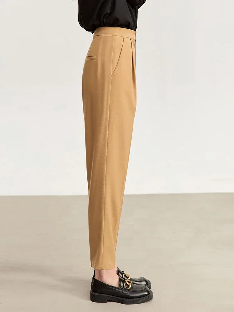 Side view of women's tailored cropped trousers in Sand Brown, showing clean pleats and structured silhouette. From Borcelleclothes.