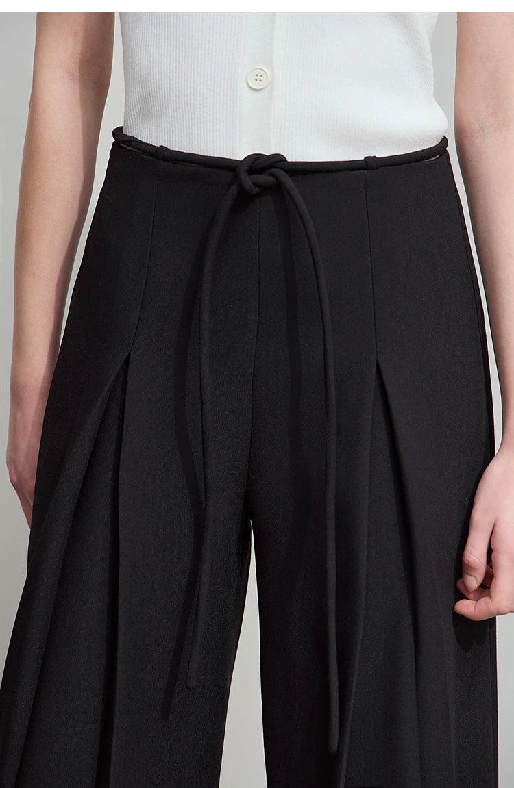 Close-up of upper section in Onyx version showing subtle waist loops and refined tailoring. From Borcelleclothes.