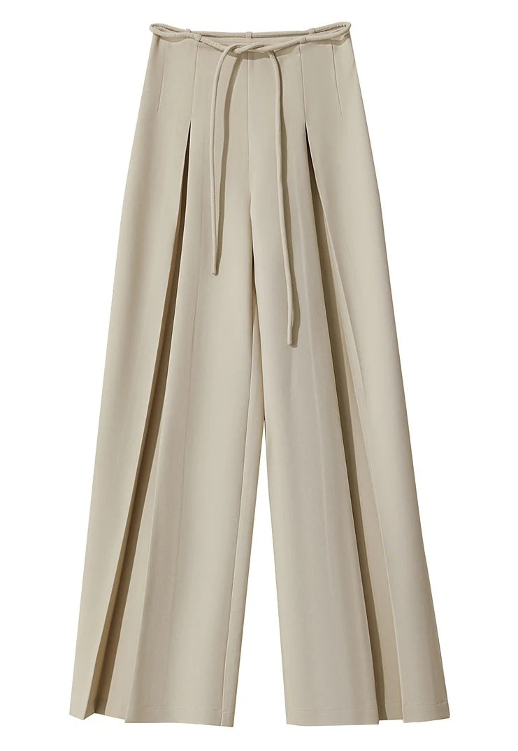 Detailed shot of front pleats creating layered visual depth and movement. From Borcelleclothes.